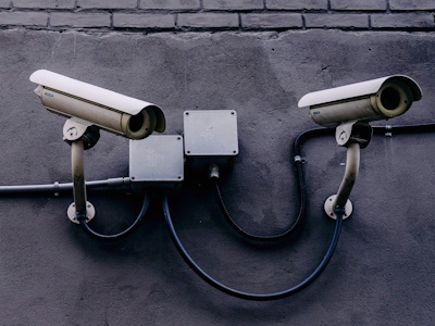 cameras surveillance system on a building wall, symbolizing data security